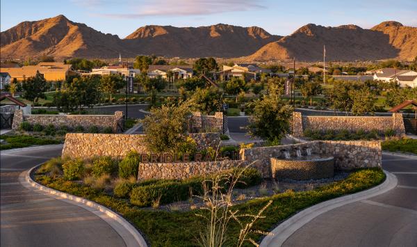 Beautiful community entrance with views of the amenities and mountains beyond