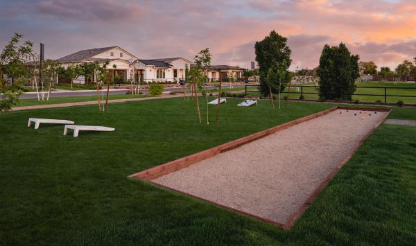 Community bocce ball court and corn hole