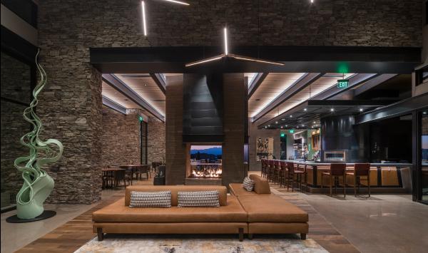 Mountain House Lodge lobby bar with dual-sided fireplace
